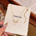 轻奢小众高级感猫眼石花朵吊坠项链女精致锆石钛钢锁骨链网红颈链