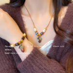 Phong cách Trung Quốc mới phong cách dân tộc thủ công dây bện trái cây khô Mặt dây chuyền vòng cổ áo len tua rua dài nữ vòng tay cổ điển Vòng cổ