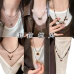 Các mẫu mùa thu và mùa đông 2025 Maillard Tiger Eye Vòng Cổ Phụ nữ phong cách Hồng Kông retro thời trang khí chất Áo len dây chuyền bán buôn