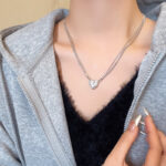 Vòng cổ tình yêu từ tính cao cấp sang trọng nhẹ nhàng, phong cách Hàn Quốc bùng nổ, tất cả phù hợp, đầy đủ kim cương, chuỗi xương đòn trái tim đào siêu lấp lánh