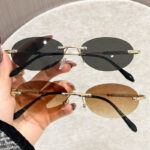 Kính râm cắt viền không khung mẫu mới Kính râm kim loại hình bầu dục nam chụp ảnh đường phố thời trang Kính râm Nữ