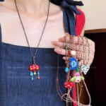 Dopamine Màu Trái Tim bện Vòng cổ phụ nữ 2025 phong cách mới dễ thương dài đeo cổ áo len dây chuyền phụ kiện