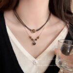 Vòng cổ mắt hổ Maillard mẫu thu đông nữ phong cách Hồng Kông cổ điển thời trang dễ phối khí chất gấp đôi Dây chuyền xương đòn đeo